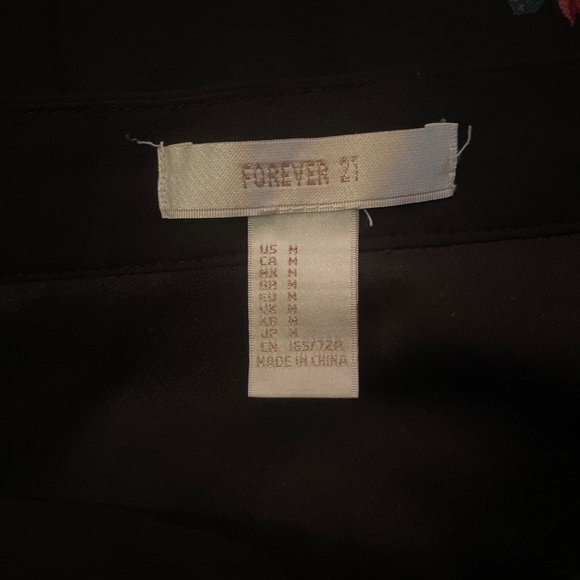 Long black skirt with red roses. Brand: Forever 21, Color: Black with red roses. - Picture 3 of 3